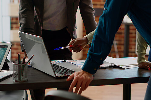 Colleagues working in front of a laptop